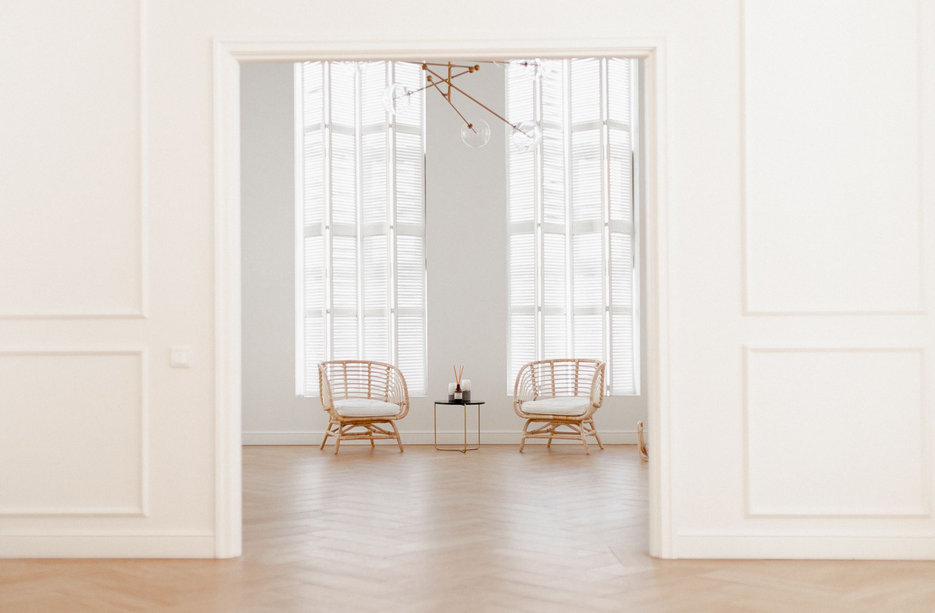 There are two chairs and a table in the room.