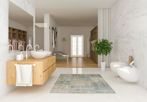 Modern bathroom remodel with marble walls and floating sinks and toilets from NTICE Designs Corp.
