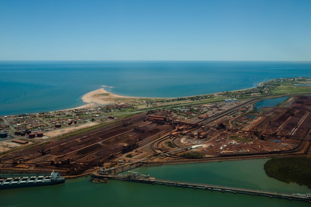 An Aerial View Of A City Next To A Body Of Water — JTM Projects Australia Pty Ltd in Port Hedland, WA
