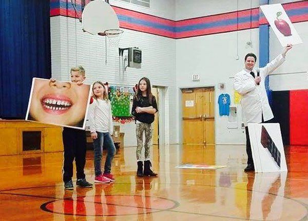 Dentist Dr. Moody at Woodland Elementary School in Edwardsville assembly