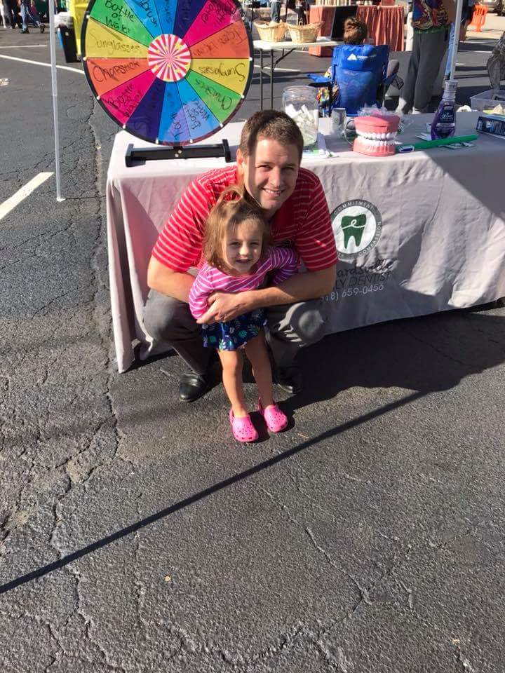 Edwardsville Cigna dental provider Dr. Beau Moody with his daughter at the Edwardsville Farmers Market