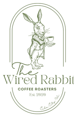 The logo for the wired rabbit coffee roasters shows a rabbit holding a cup of coffee.