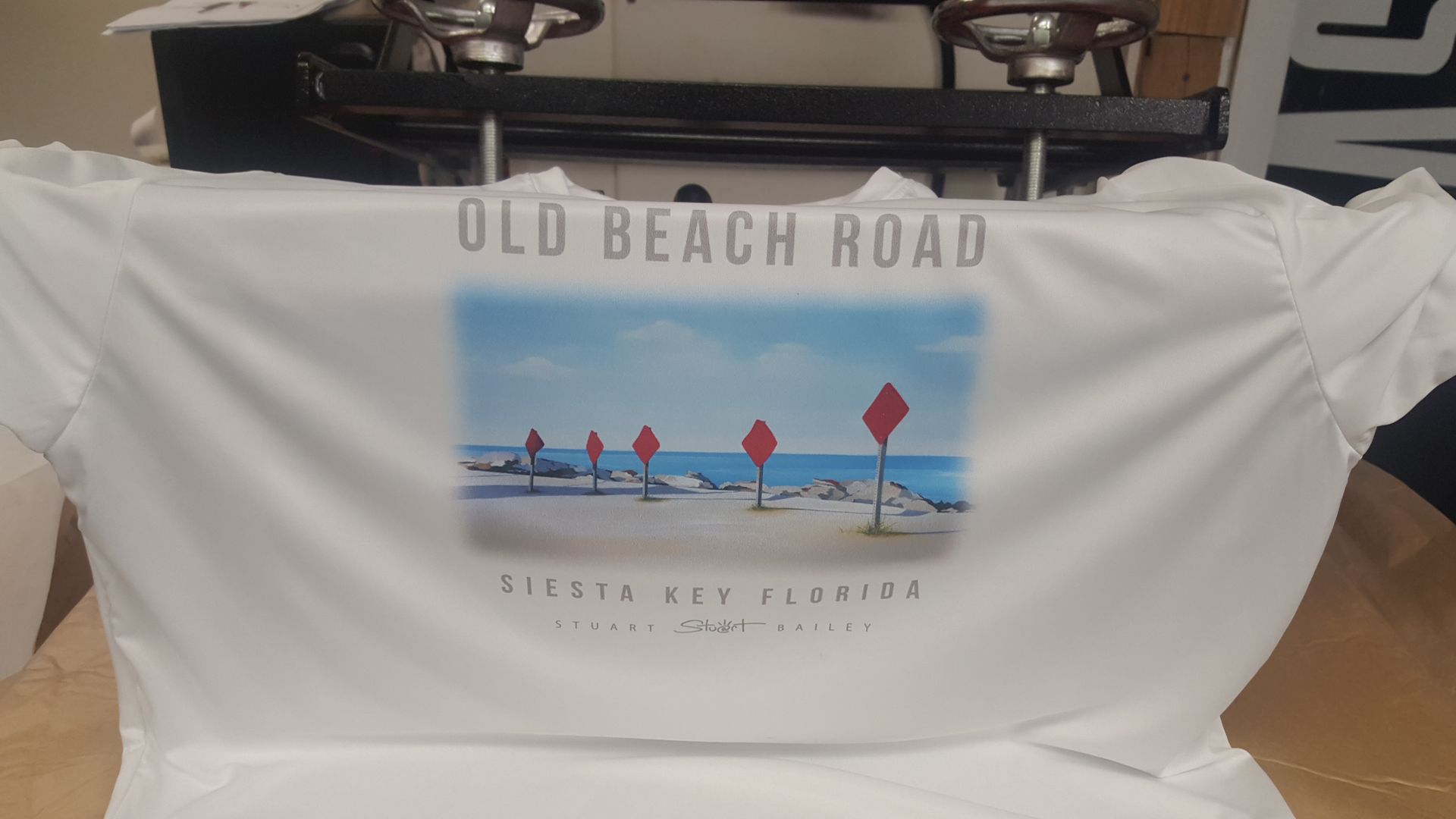 A white t-shirt with the words old beach road on it