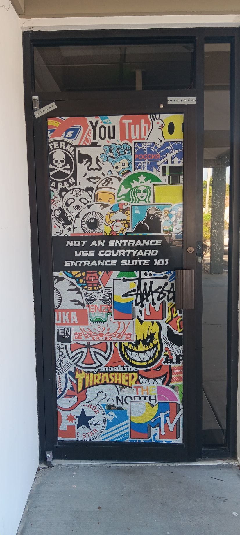 A door with a lot of stickers on it
