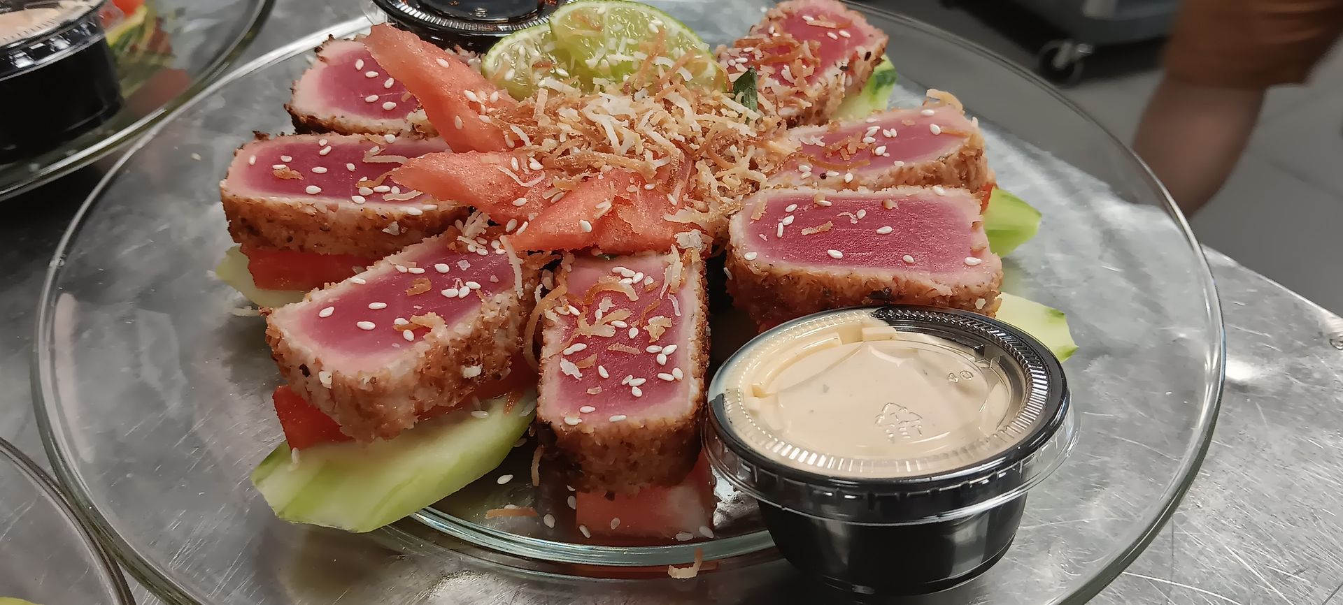 A close up of a plate of food with sauce on a table.