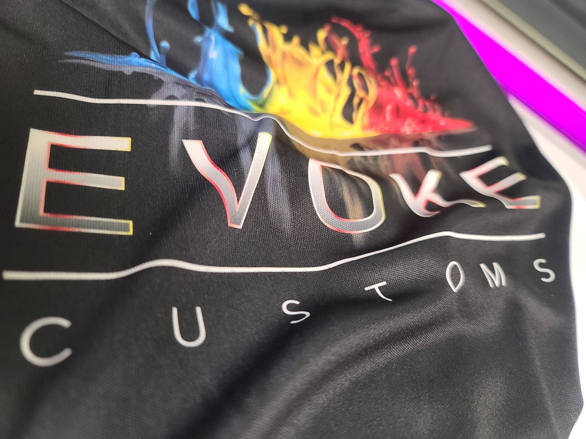 image shows close up detail view of dye sublimation process printing for tee shirt apparel