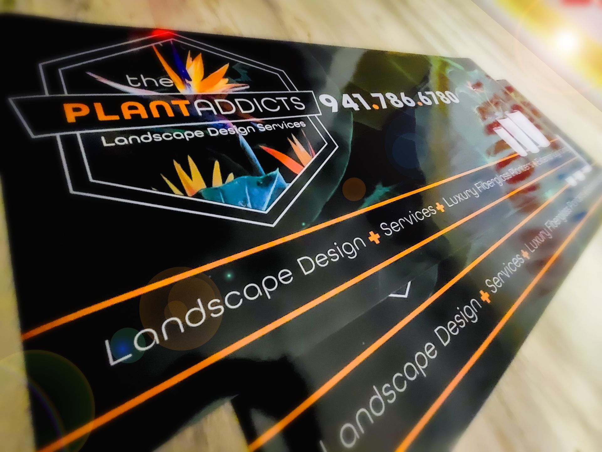 A business card for the plantaddicts landscape design