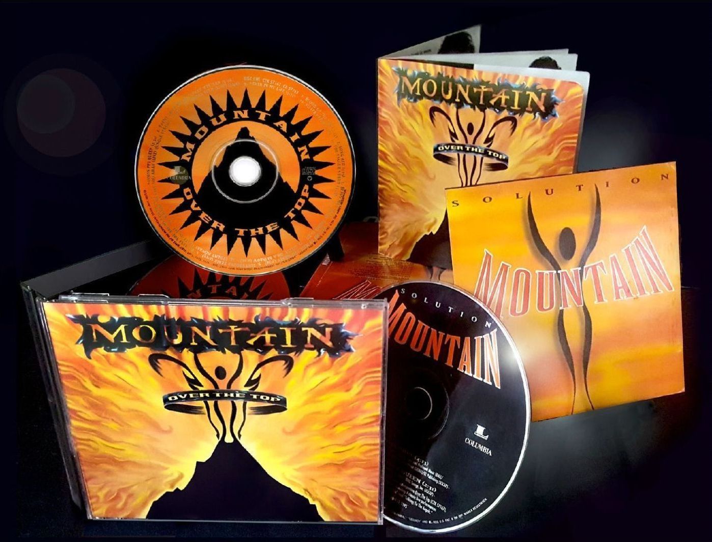 A cd called mountain is sitting on a table