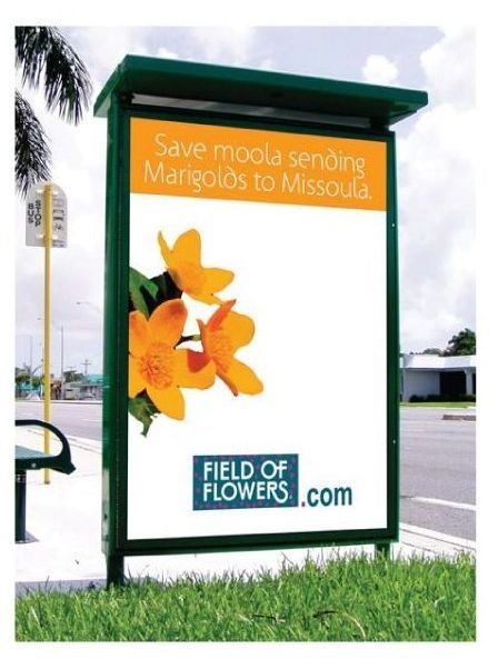 A billboard that says field of flowers on it