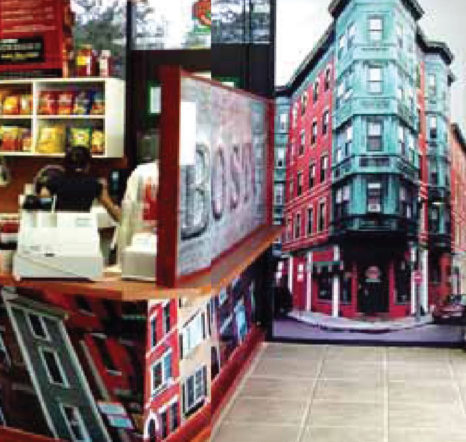 A restaurant with a large picture of a city on the wall.