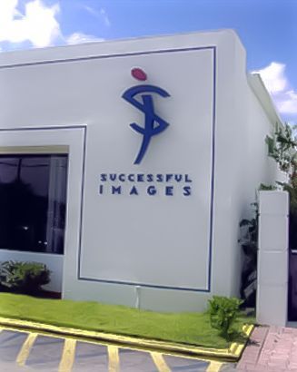 A white building with successful images written on it