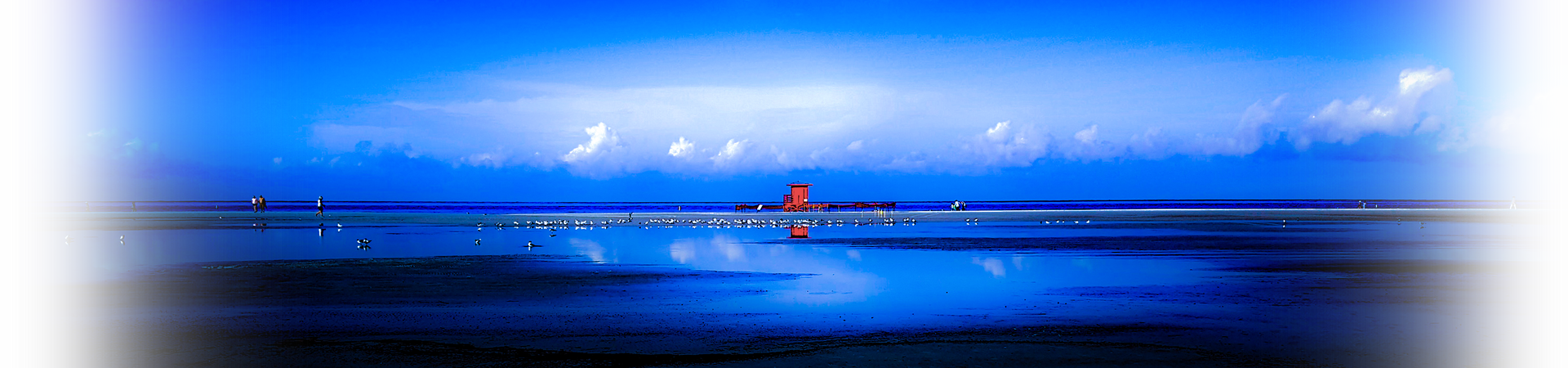 Long panoramic image of a red lifeguard stand Siesta Key Beach Florida