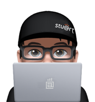 A man wearing glasses and a black hat with stu @ rt written on it
