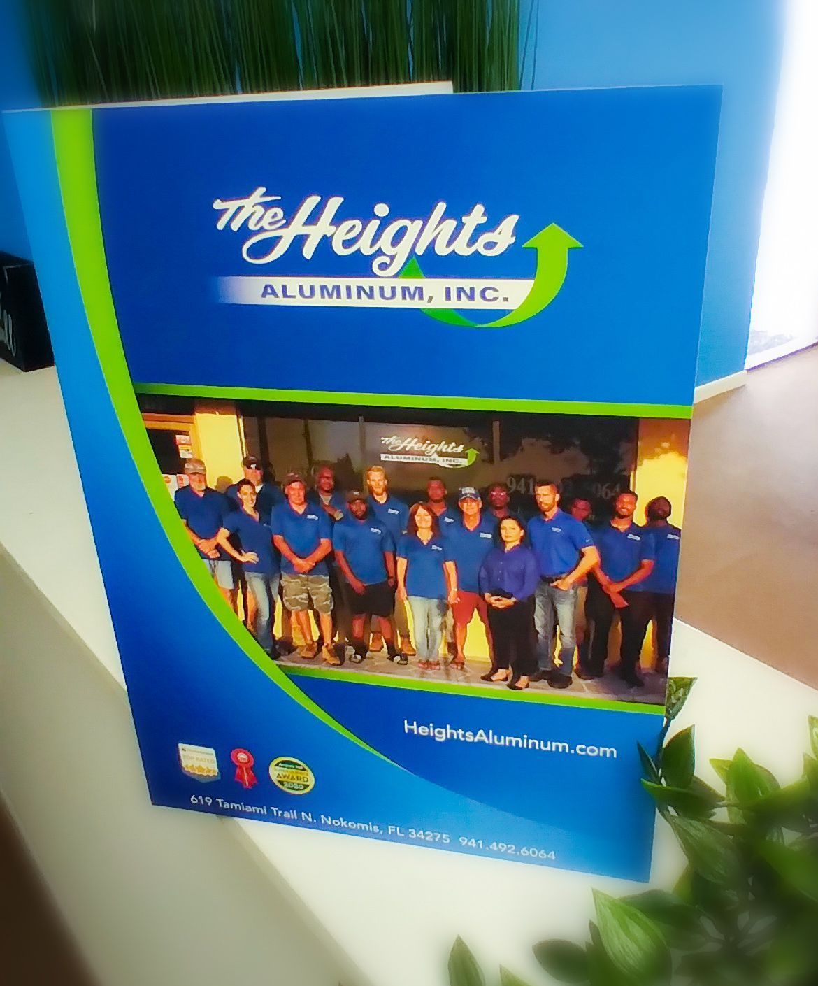 A blue and green brochure for the heights aluminum inc.