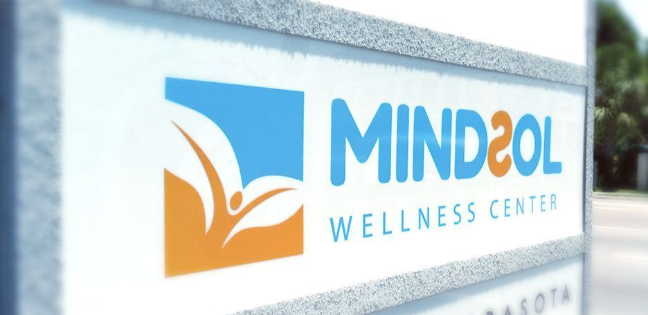 A sign for mind2ol wellness center in sarasota