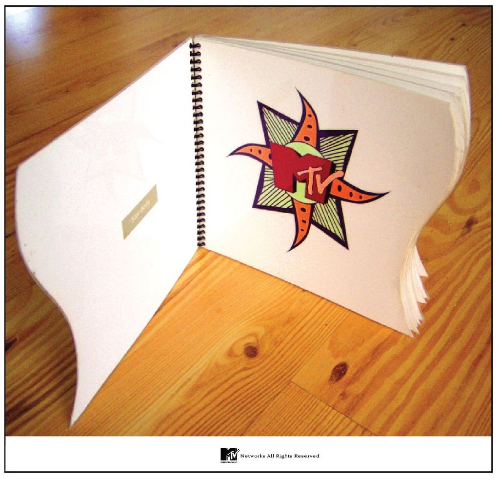 A book is open to a page that says mtv on it