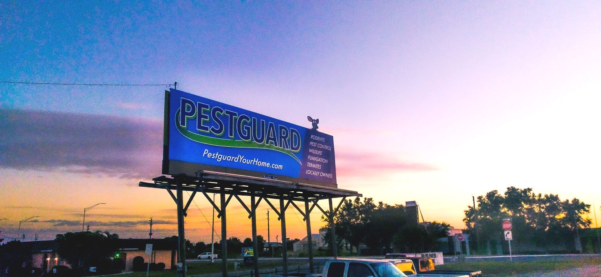 A large Stu-Art billboard with the word pestguard on it