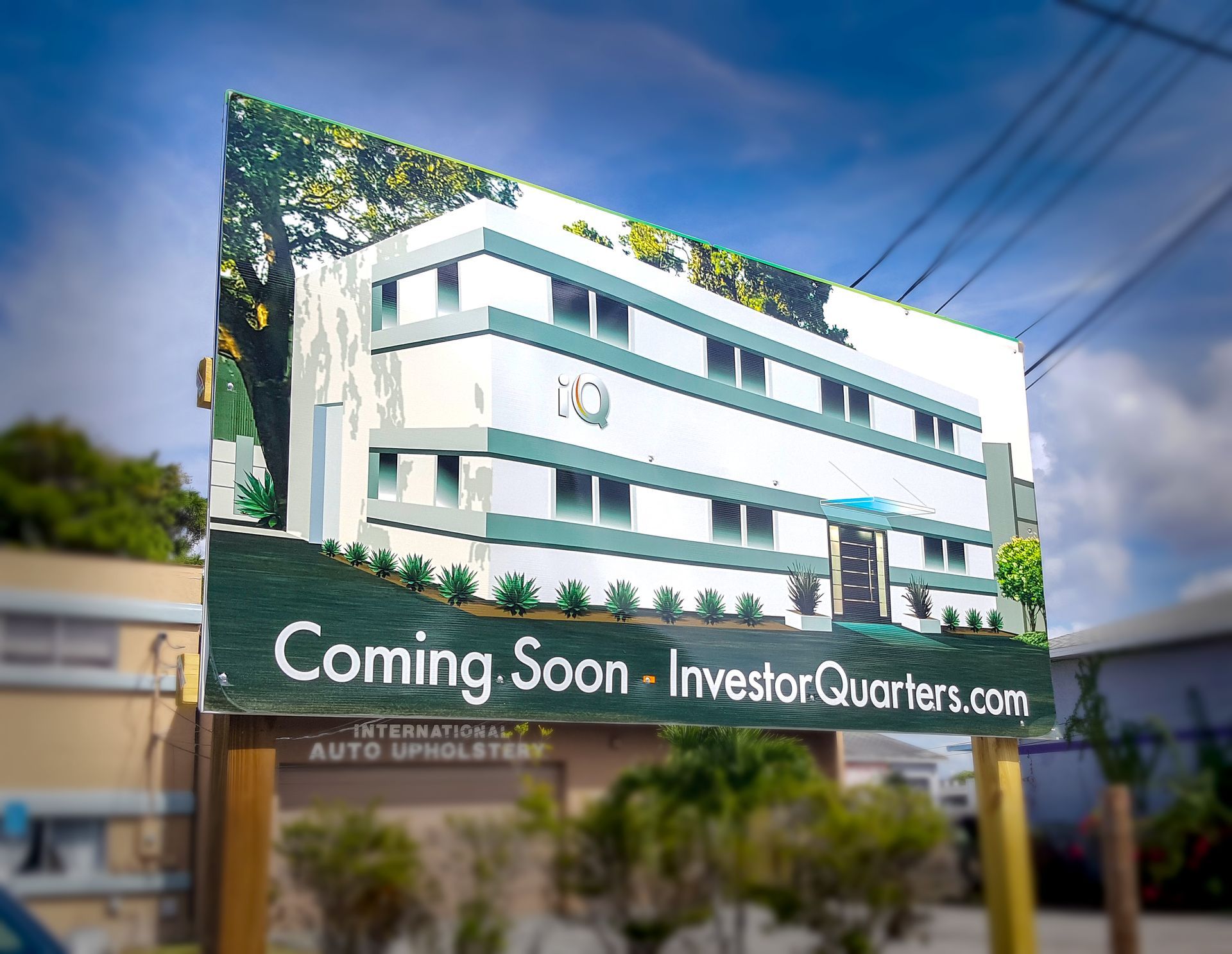 A billboard advertising a building that is coming soon