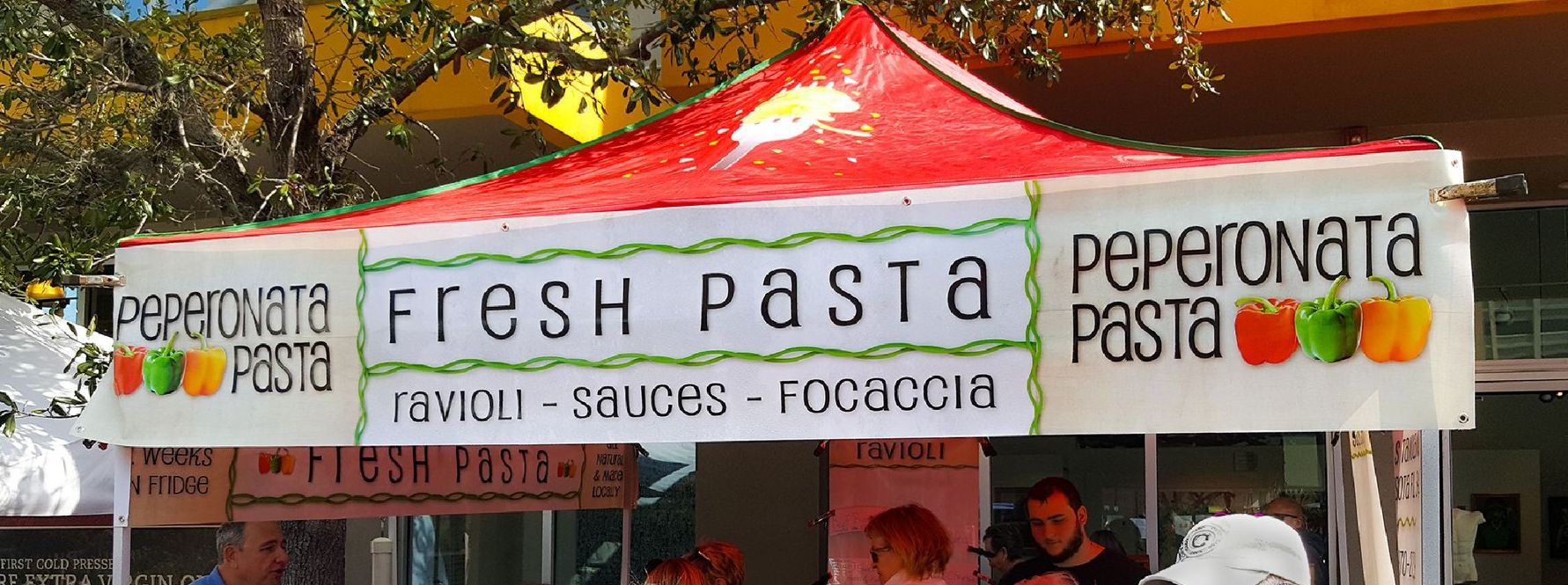 A tent with a sign that says fresh pasta