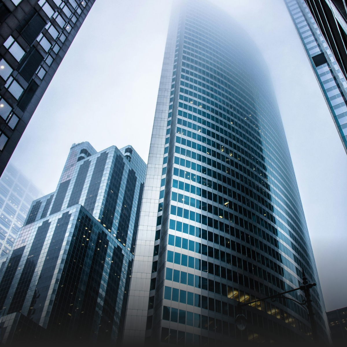 A woman is sitting at a table talking to a man and a woman.