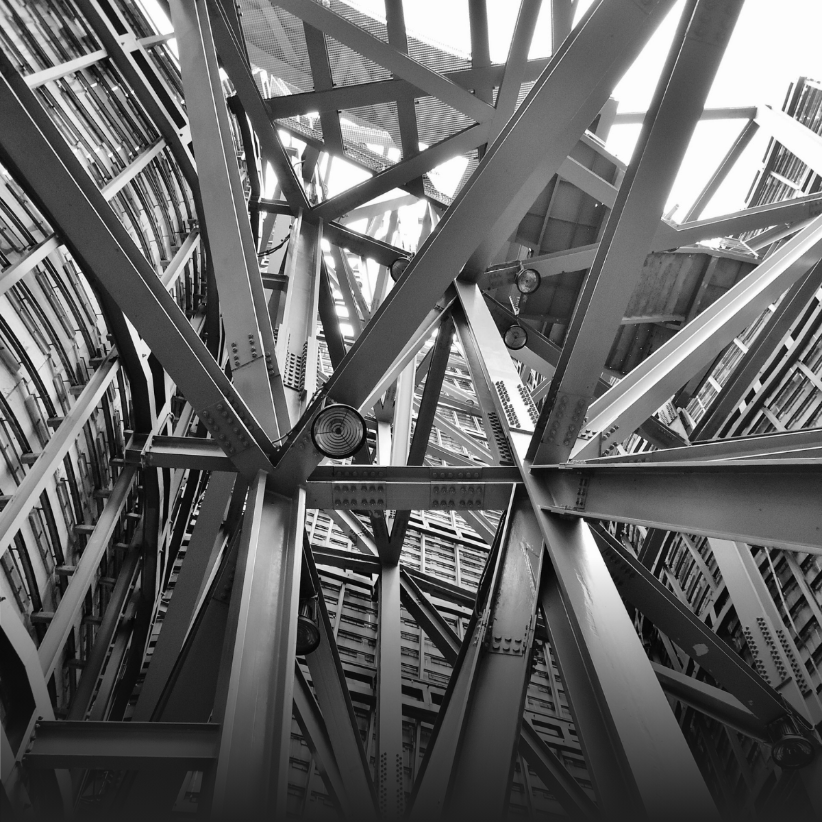 Two men are shaking hands in a conference room.