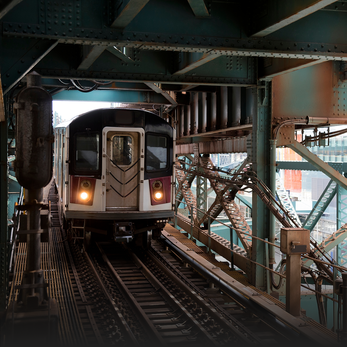 A woman is sitting at a table talking to a man and a woman.