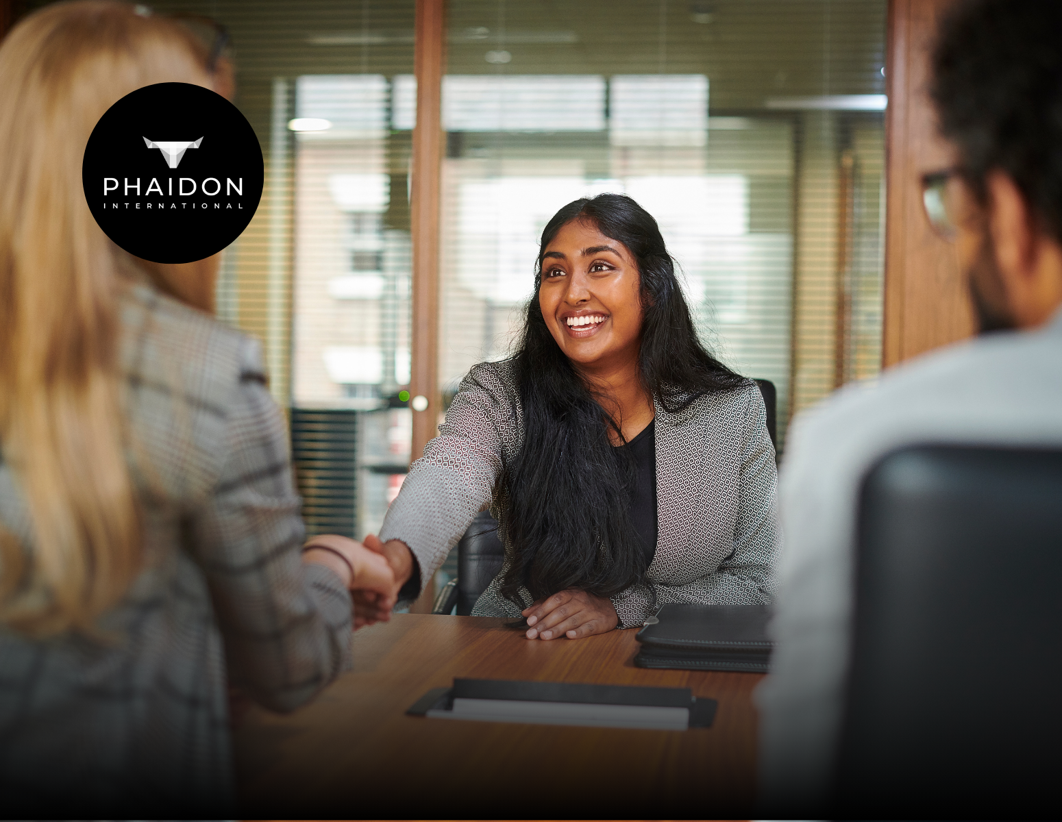 A black and white logo for phaidon international north america