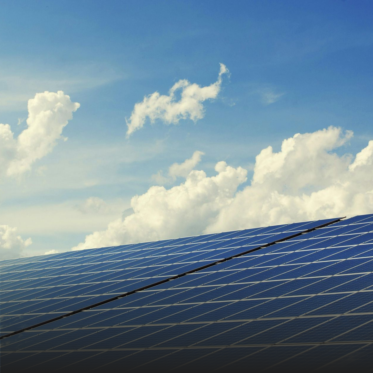 Two men are sitting at a table having a conversation.