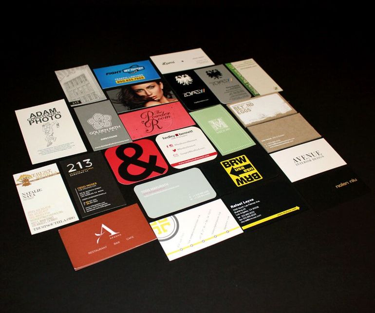 A collection of business cards including one for adam photo