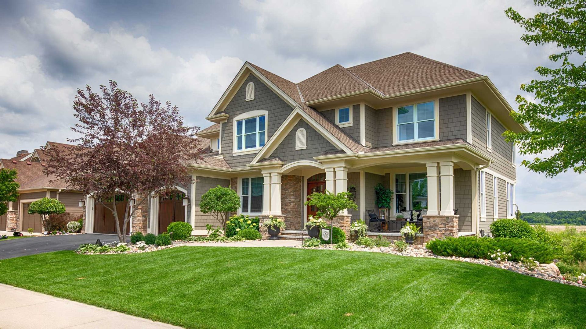 a house with a nicely mowed lawn
