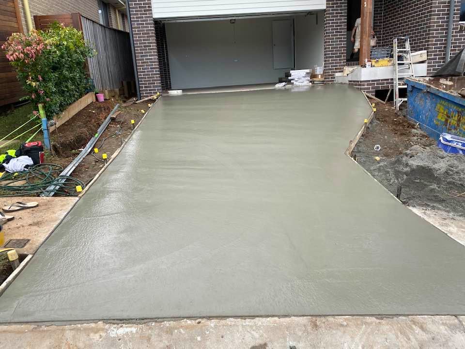 Fresh Wet Concrete Driveway — Concreters in Port Macquarie, NSW