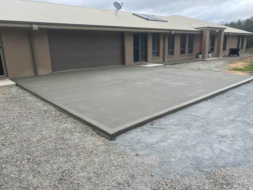 Concrete Driveway In Front Of The Garage — Concreters in Port Macquarie, NSW
