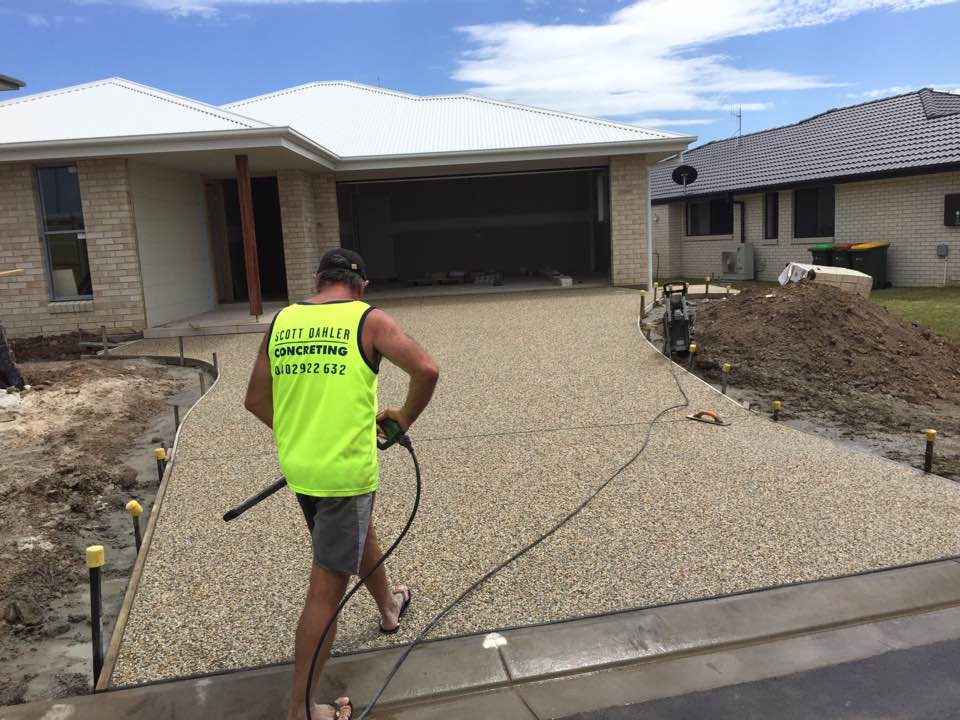 Man Holding A Concrete Equipment — Concreters in Port Macquarie, NSW