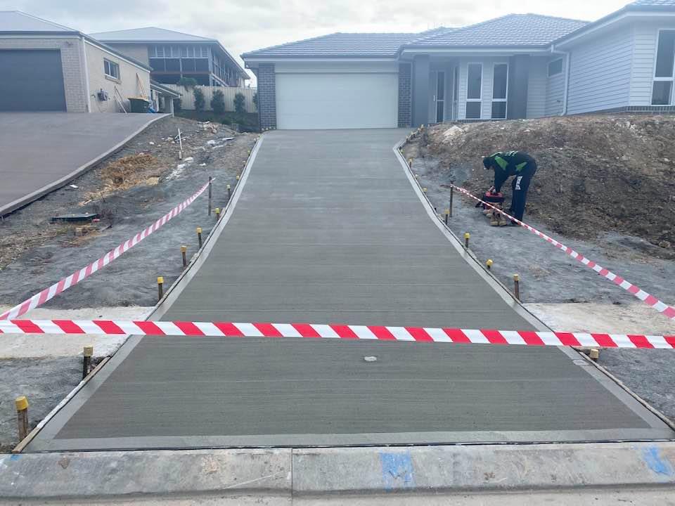 Sealed Down Slope Concrete Driveway — Concreters in Port Macquarie, NSW