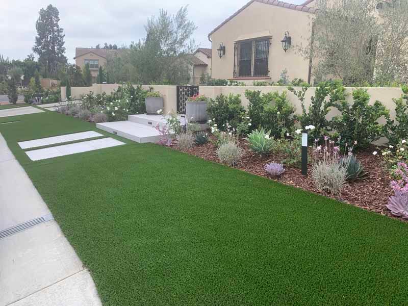 backyard with plank and artificial grass