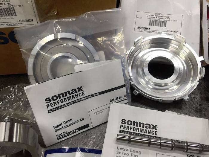 A bunch of sonnax performance parts on a table