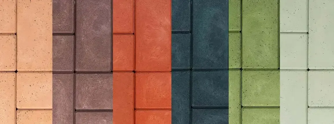 A row of bricks of different colors are lined up in a row.