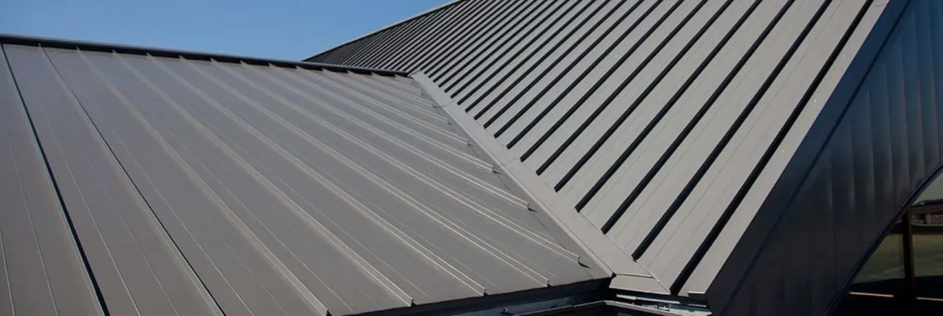 A close up of a metal roof on a building.
