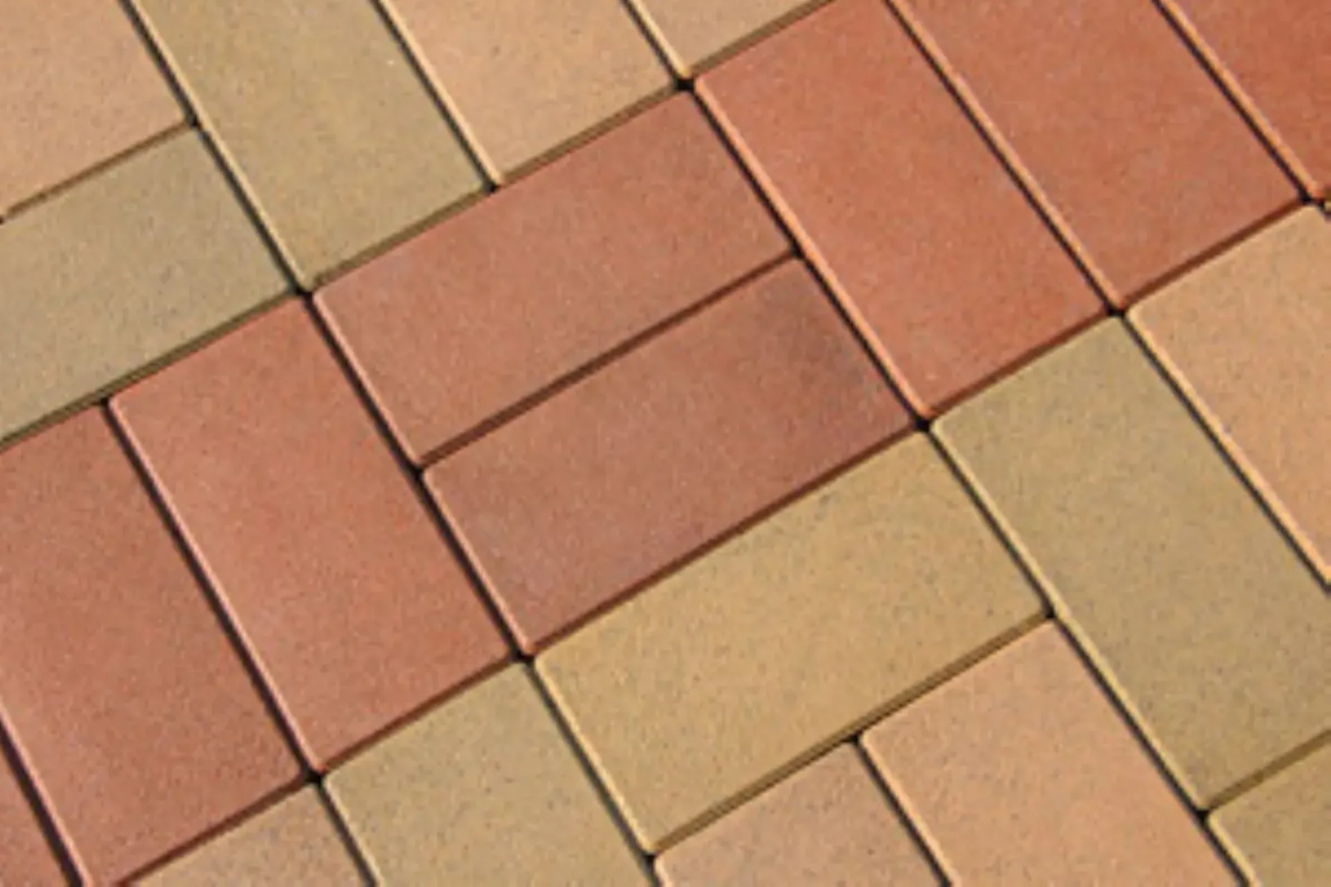 A close up of a brick floor with a diagonal pattern