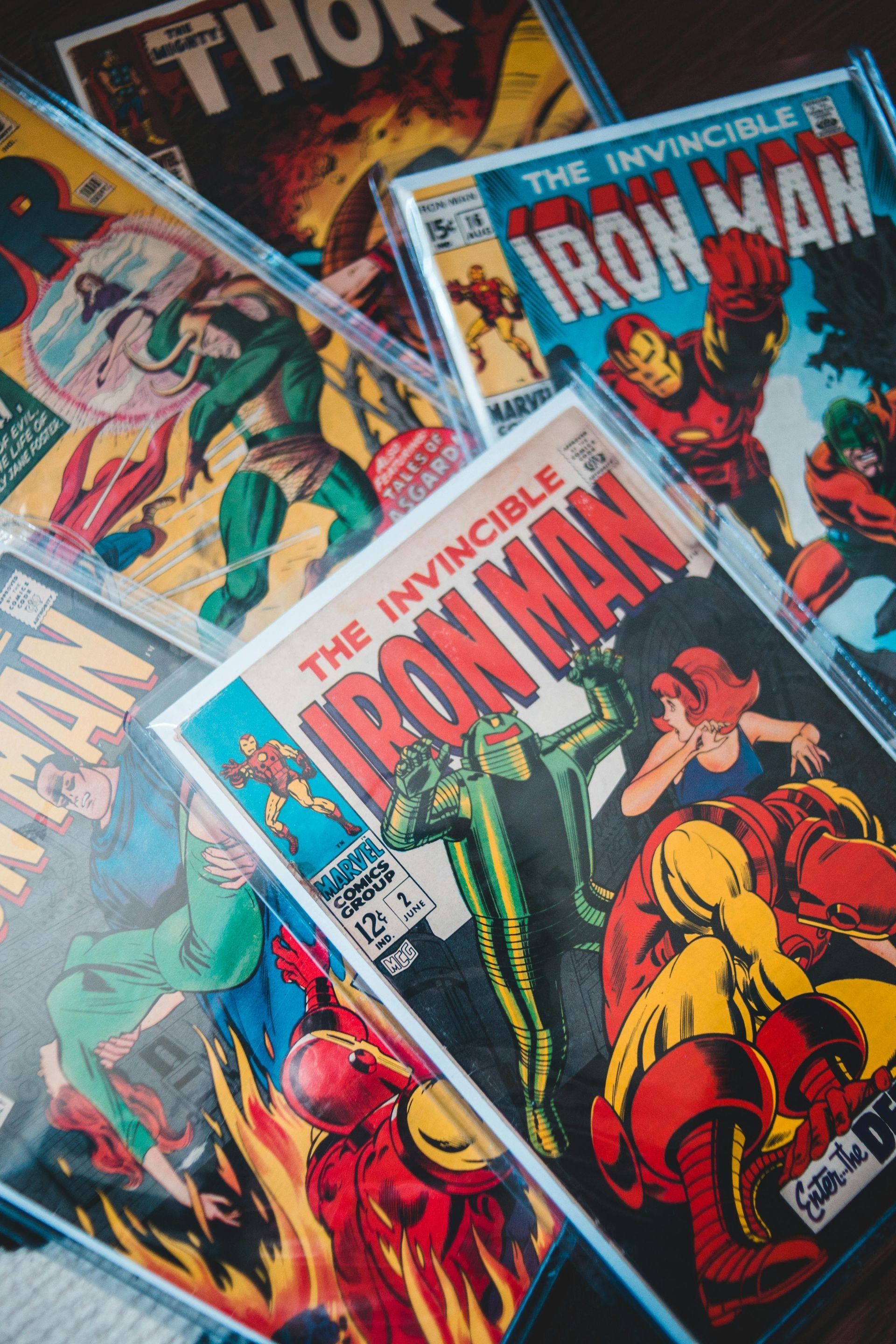 A collection of comic books including the invincible iron man