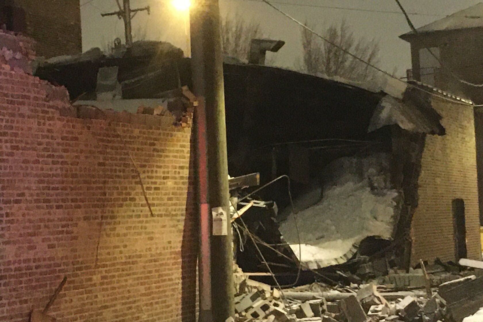 Collapsed vacant brick building in Bridgeport after heavy snowstorm, showing winter-related masonry failure.