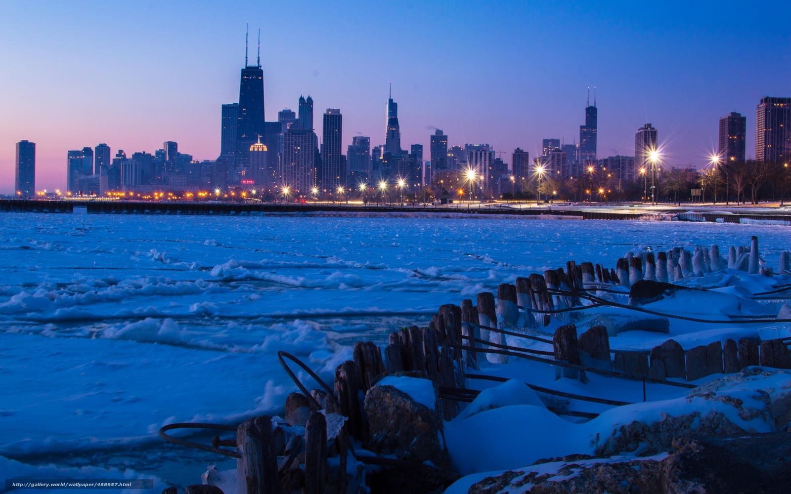 Frozen Lake Michigan with Chicago skyline in winter, showing harsh Midwest conditions that impact masonry buildings.