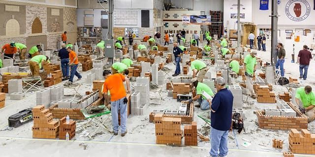 Union masonry apprentices participating in hands-on training at the International Masonry Institute