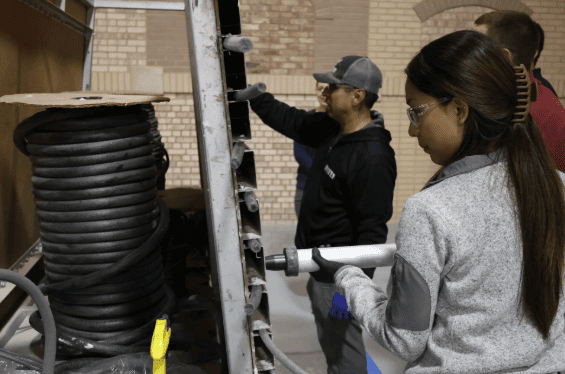 Hands-on sealant installation and joint preparation training during RestoreWorks and IMI masonry restoration workshop in Addison Illinois
