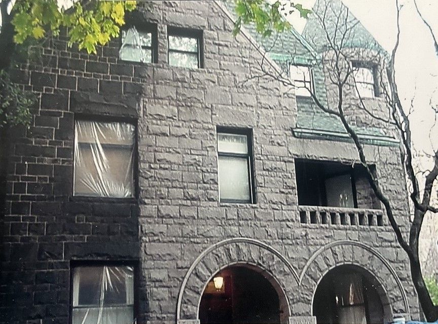 A luxury home with a green roof