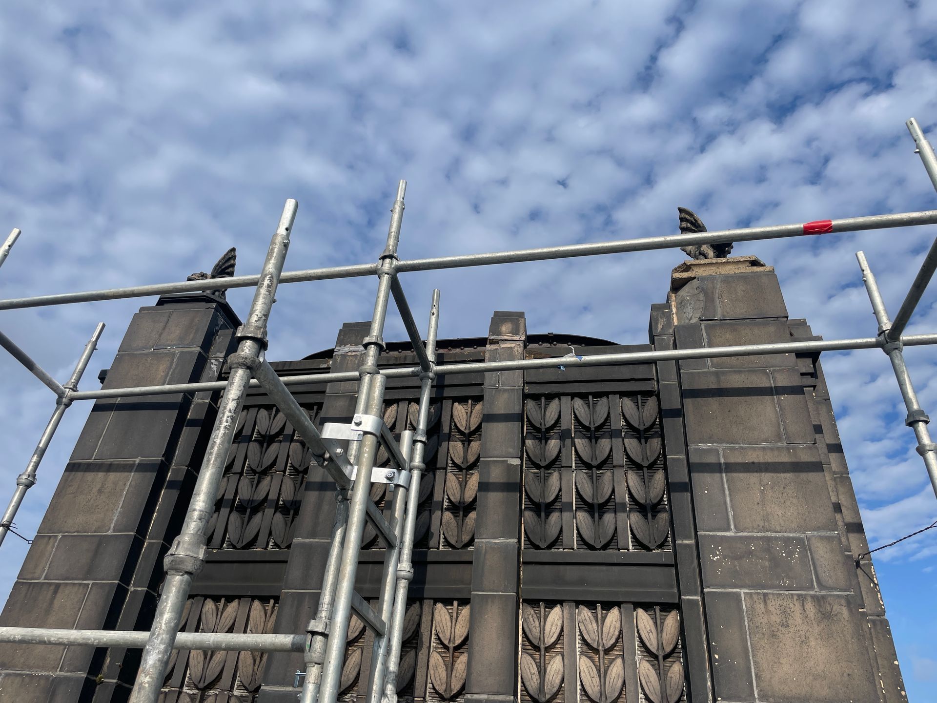 The Chicago Civic Opera house with scaffolding around it and a blue sky in the background