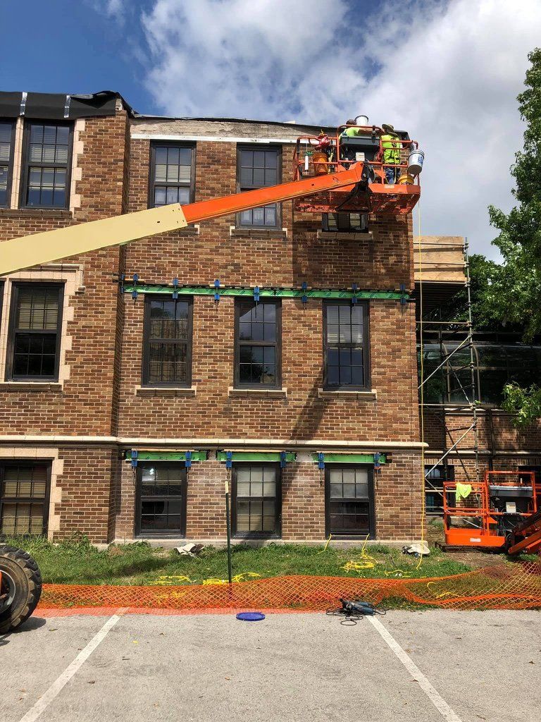 a crane removing old parapet