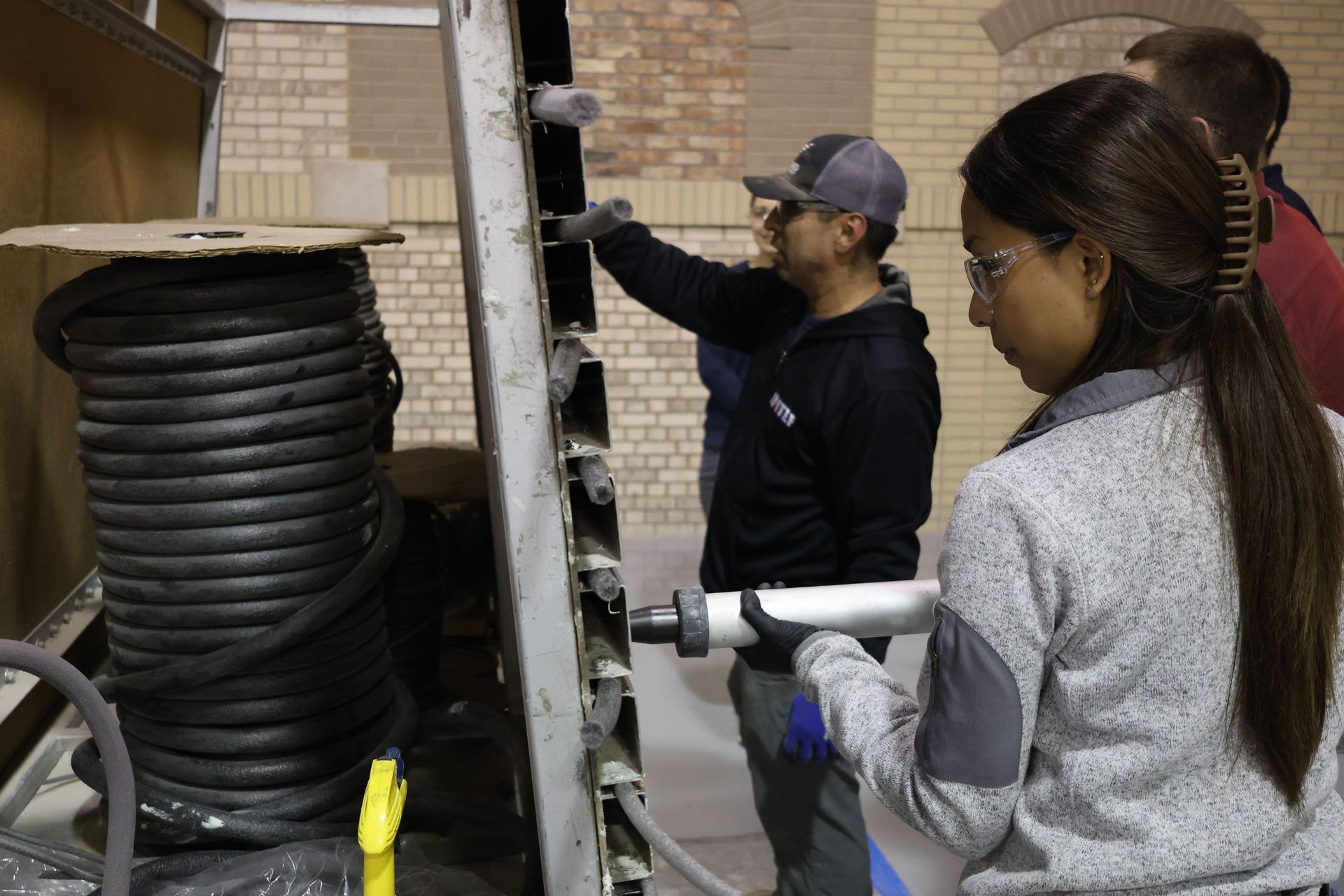 Participant applying sealant during hands-on training at the RestoreWorks and IMI masonry workshop