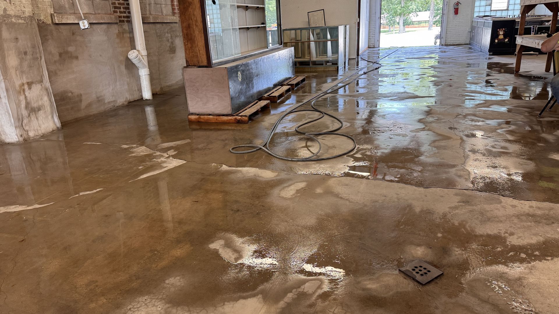 Interior of Meeker Hall after masonry restoration, with freshly pressure-washed concrete floors and all temporary coverings removed by RestoreWorks to restore a clean and orderly environment in this active public facility.