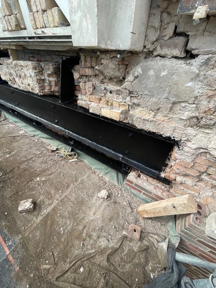 A brick wall with a steel beam in the ballroom at Navy Pier